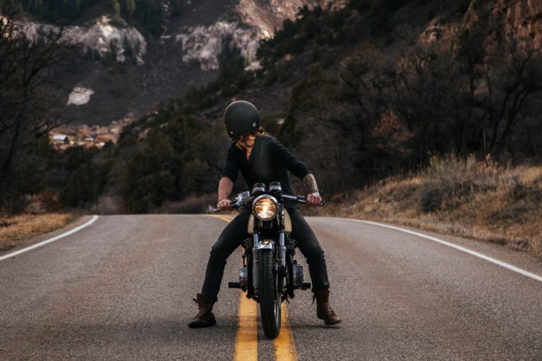 motorcycle rider with a black helmet